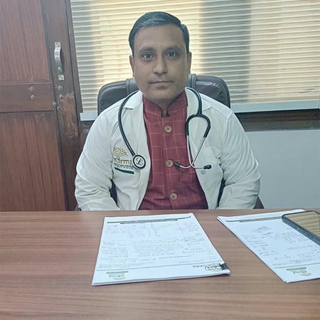 Dr. Chintamani Upadhyay consulting a patient about Parkinson's care